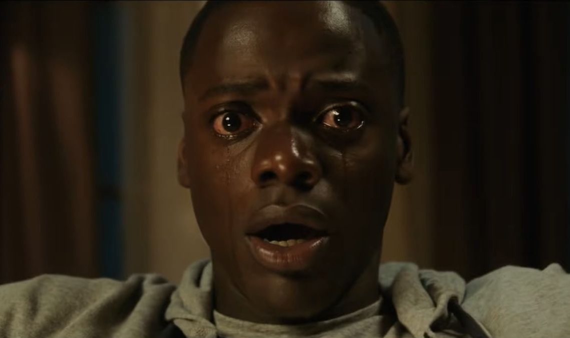 A close-up of Daniel Kaluuya shedding tears in a scene from Get Out.