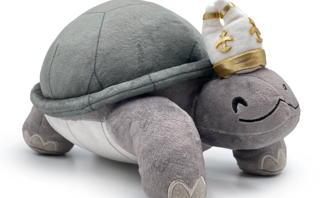 Another angle of the Turtle Pope, who is serene and chill and also a plushie.