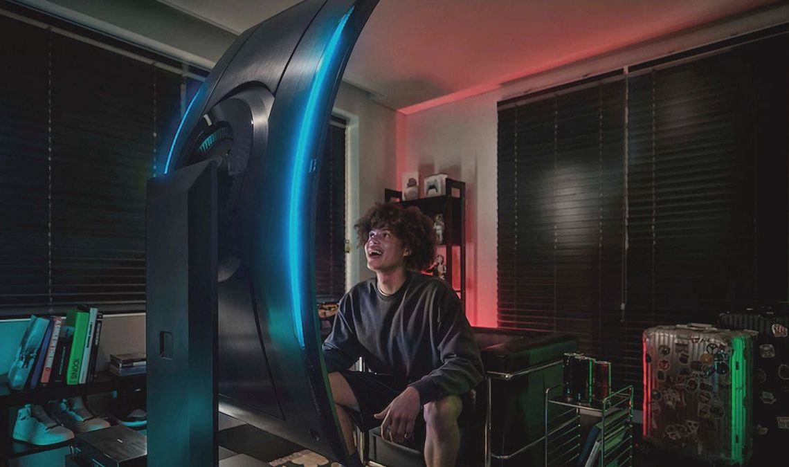 A man looking at the Samsung Odyssey Ark in vertical mode